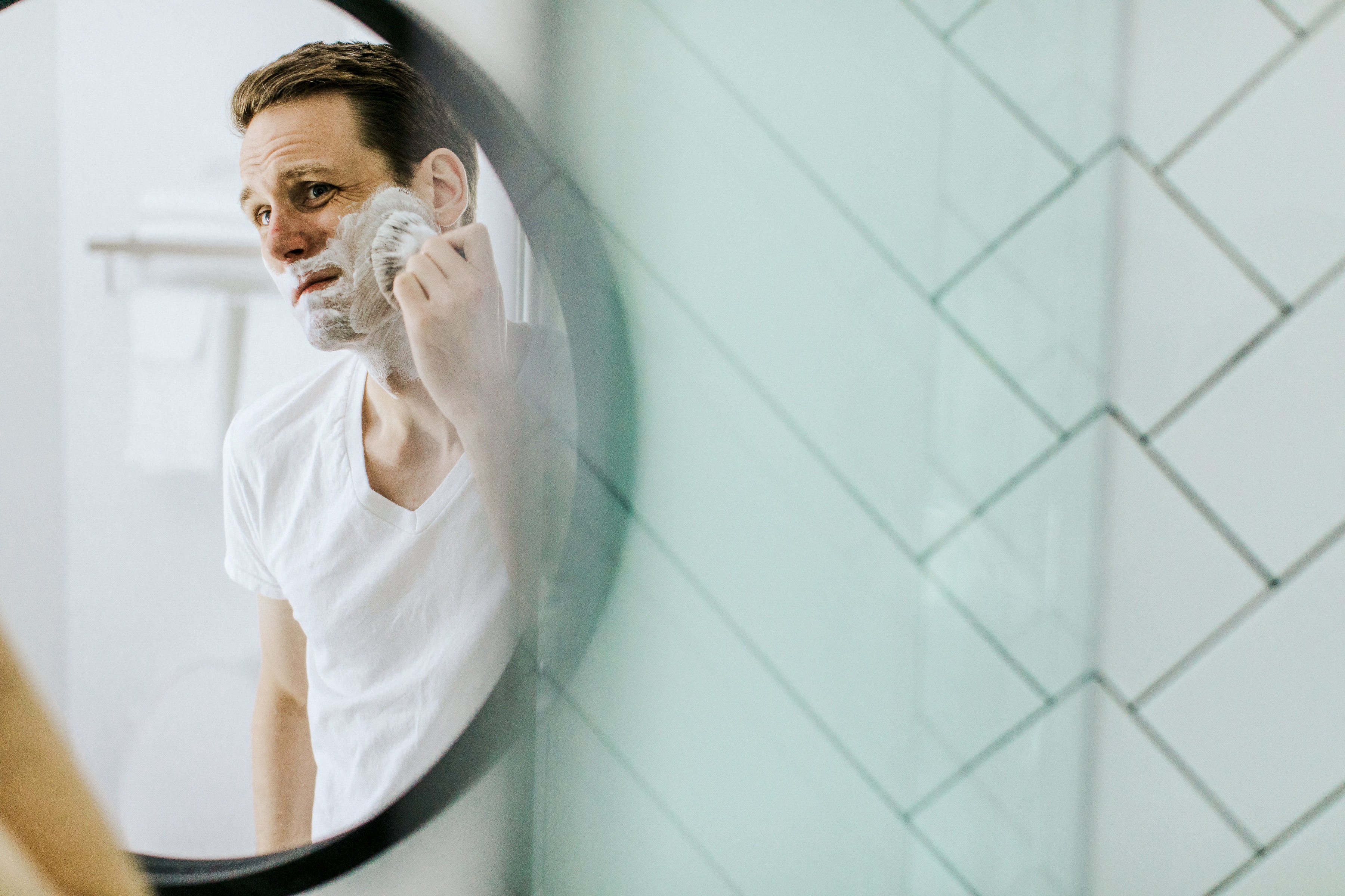 Man applying shaving cream