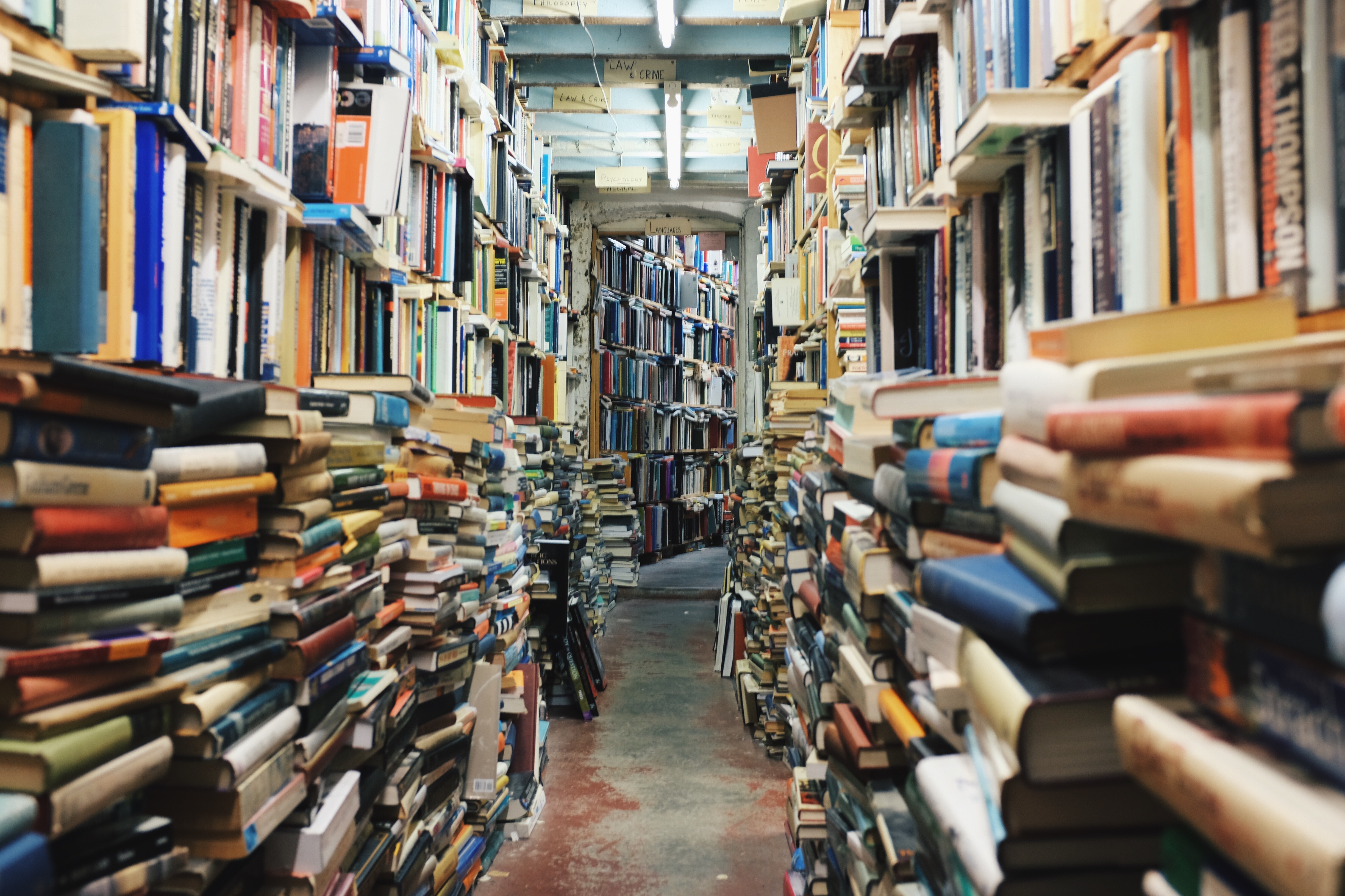 A narrow corridor lines with books