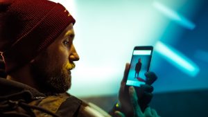 Man looking passively at smartphone
